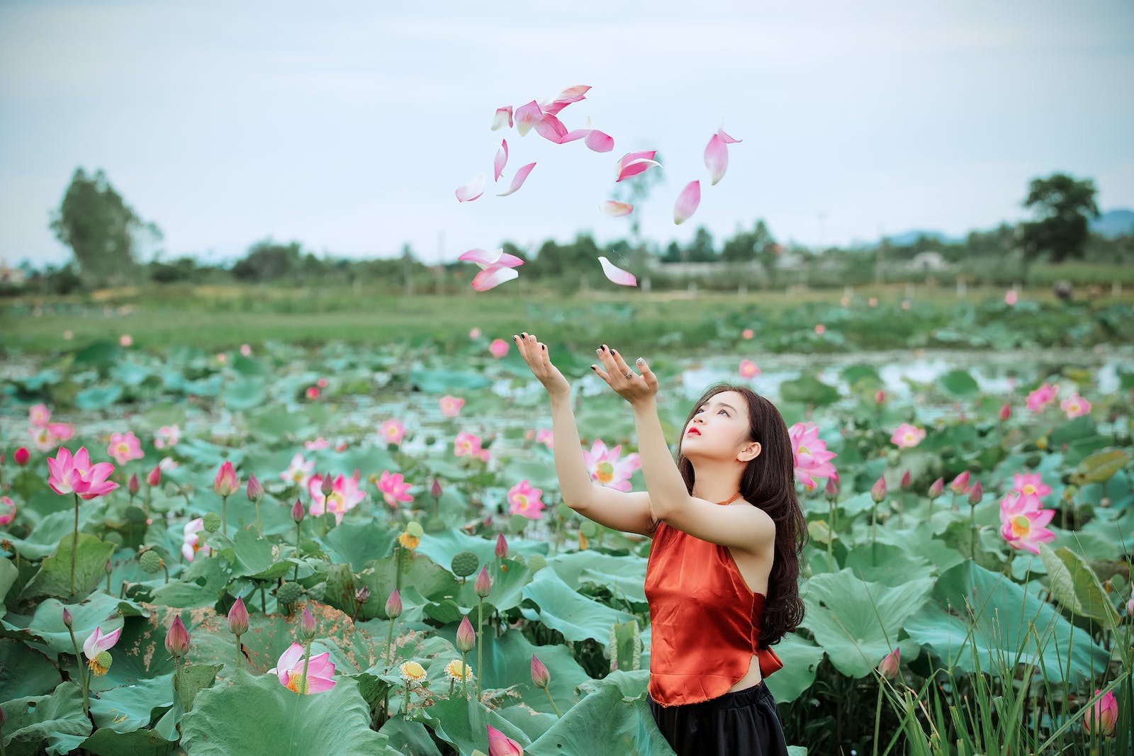 Woman Throwing Pink Petals